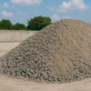 Gravel-Mound-in-Industrial-Setting.png Bendingan 3 x 4 cm